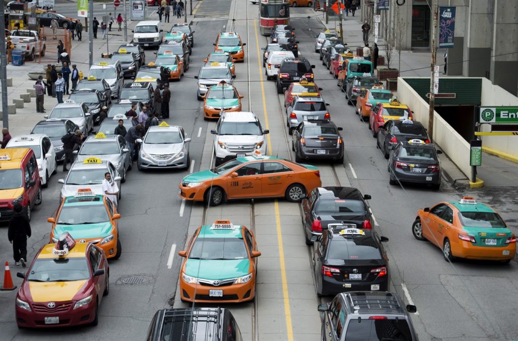 Toronto taxi drivers threaten job action