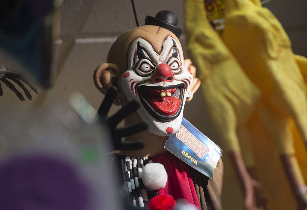 Halloween costumes and props, including a "scary" clown mask, are seen for sale at Total Party, a party store, in Arlington, Virginia, October 7, 2016. / AFP / SAUL LOEB        (Photo credit should read SAUL LOEB/AFP/Getty Images)